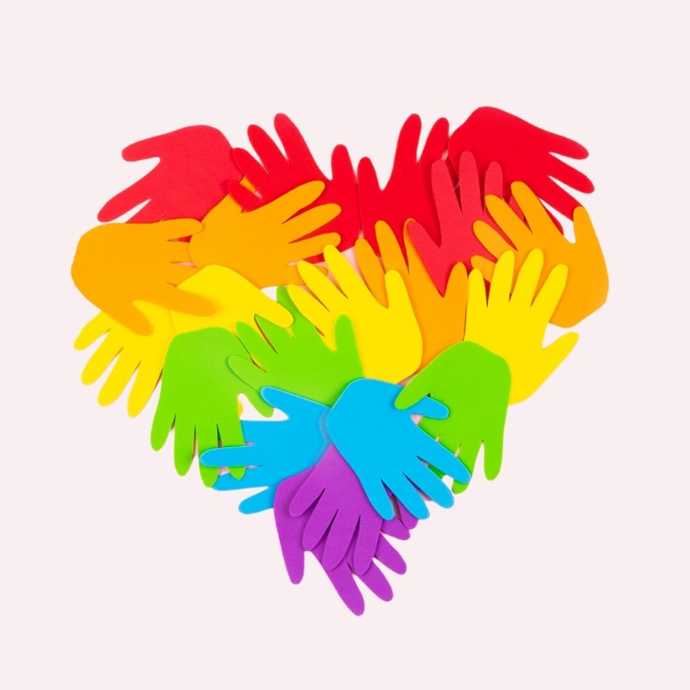 Colourful hands in heart shape