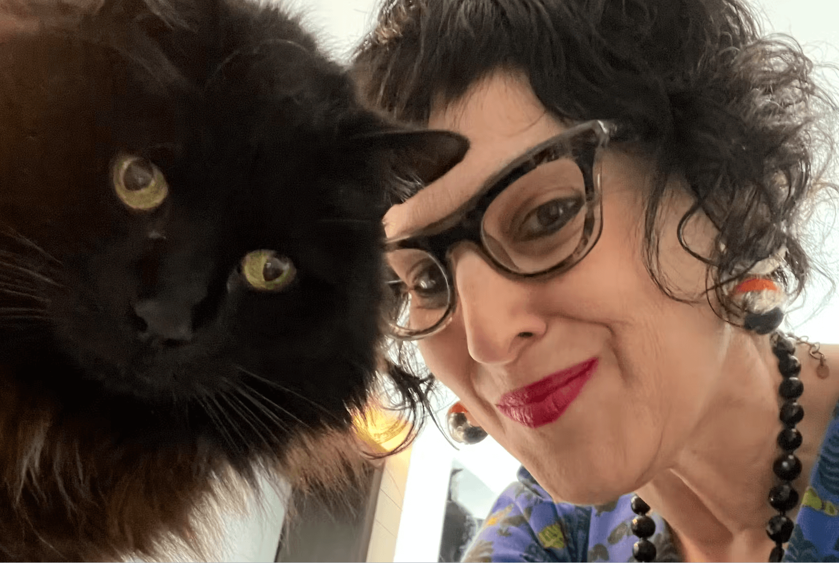 Lisa Goldberg and a black Cat